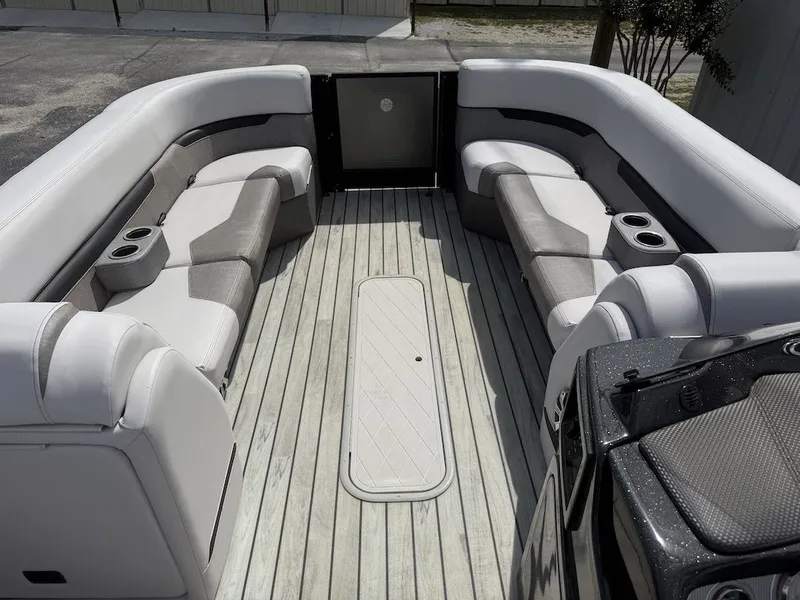 Slide: The Image of Interior of 2017 Crest Caliber 250 SLR2 pontoon boat with gray seating. - 7