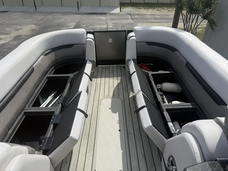 Slide: The Image of Interior of a 2017 Crest Caliber 250 SLR2 boat with storage compartments. - 9