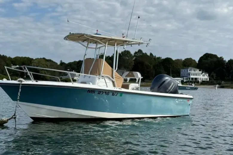 The Image of 2018 Edgewater 188CC boat anchored on calm water with scenic background. - 0