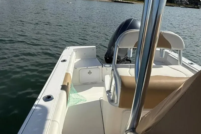 Slide: The Image of 2018 Edgewater 188CC boat interior with seating and water view. - 14