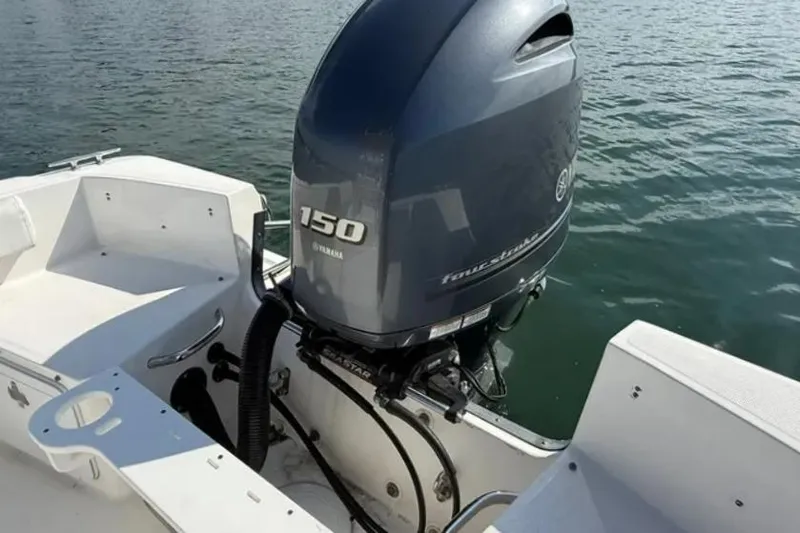 Slide: The Image of 2018 Edgewater 188CC boat with Yamaha 150 outboard motor on water. - 16