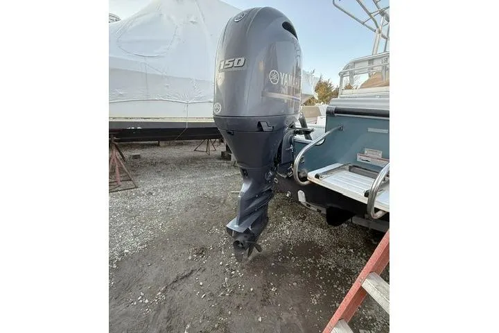 Slide: The Image of 2018 Edgewater 188CC boat with Yamaha 150 outboard motor in storage. - 17