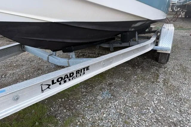 Slide: The Image of 2018 Edgewater 188CC boat on Load Rite trailer, parked on gravel. - 19