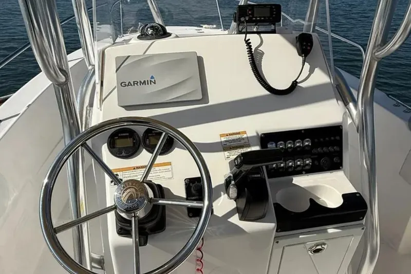 Slide: The Image of 2018 Edgewater 188CC boat console with Garmin navigation and steering wheel. - 5