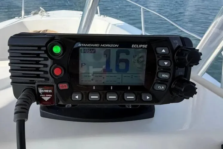 Slide: The Image of VHF radio on 2018 Edgewater 188CC boat, displaying channel 16 on water. - 8