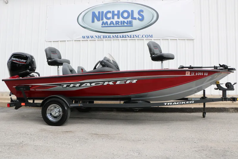 The Image of 2024 Tracker Pro Team 175 boat in red, displayed at Nichols Marine dealership. - 1