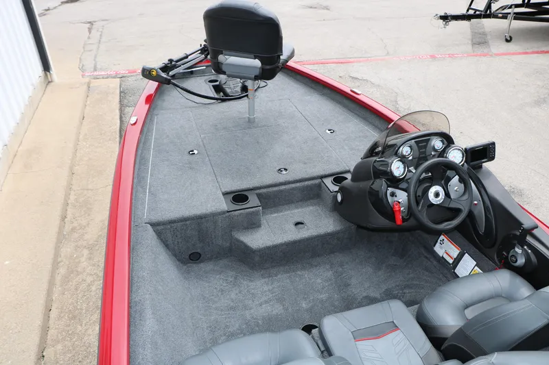 Slide: The Image of 2024 Tracker Pro Team 175 boat interior with steering console and seating. - 13