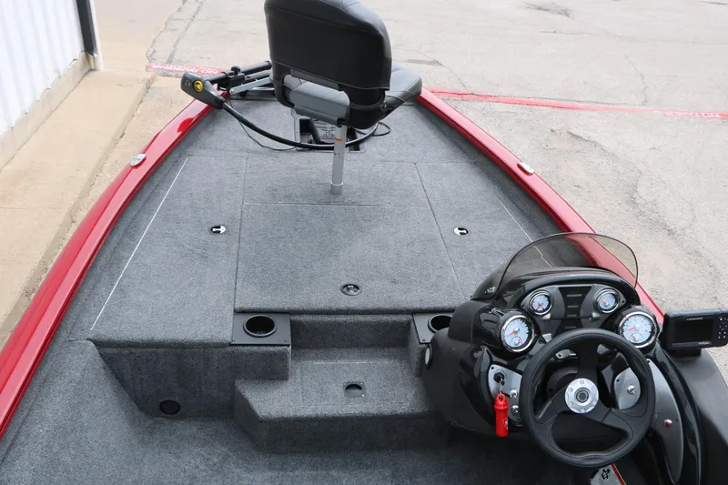 Slide: The Image of 2024 Tracker Pro Team 175 boat interior with steering console and seating. - 15