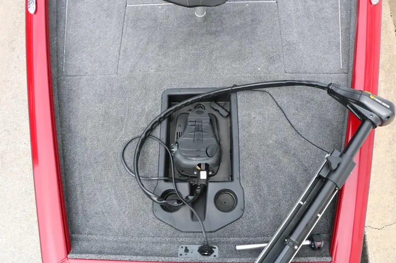 Slide: The Image of 2024 Tracker Pro Team 175 boat deck with trolling motor and carpeted surface. - 19