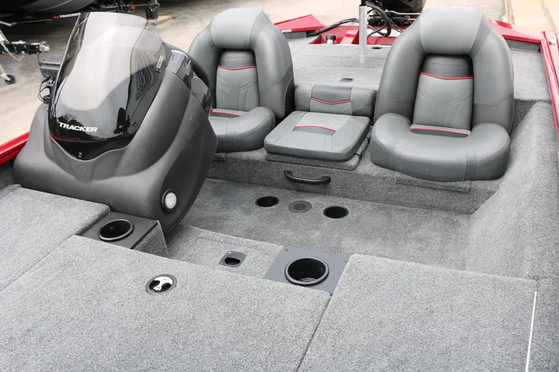 Slide: The Image of 2024 Tracker Pro Team 175 boat interior with gray seating and carpeted deck. - 22