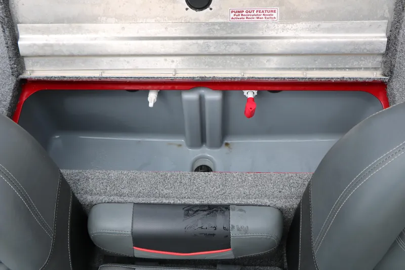 Slide: The Image of 2024 Tracker Pro Team 175 boat interior storage compartment with pump-out feature. - 24