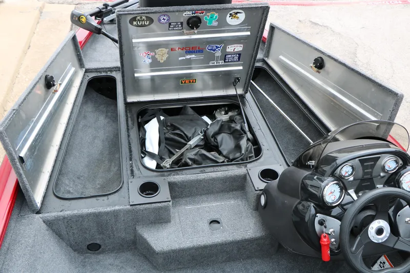 Slide: The Image of 2024 Tracker Pro Team 175 boat interior with storage compartments and control panel. - 25