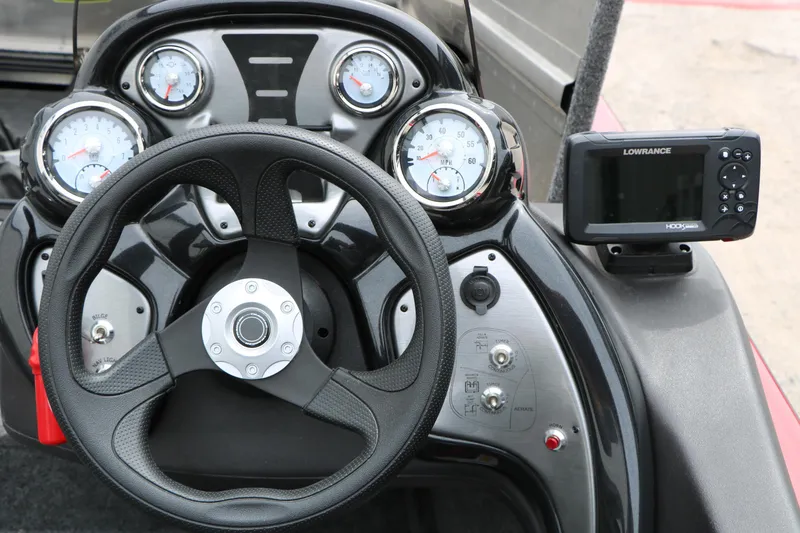 Slide: The Image of 2024 Tracker Pro Team 175 dashboard with steering wheel and Lowrance fishfinder. - 26