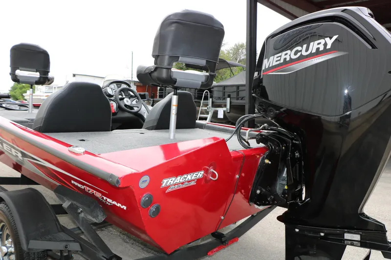 Slide: The Image of 2024 Tracker Pro Team 175 boat with Mercury engine, red exterior, and dual seating. - 8