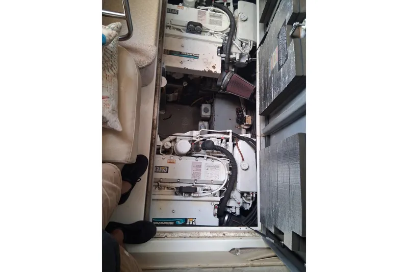Slide: The Image of Engine compartment of a 2000 Sea Ray 420 Aft Cabin yacht, showcasing mechanical components. - 27