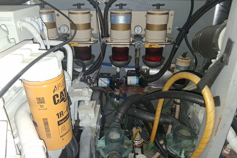 Slide: The Image of Engine room of 2000 Sea Ray 420 Aft Cabin with filters and hoses visible. - 29