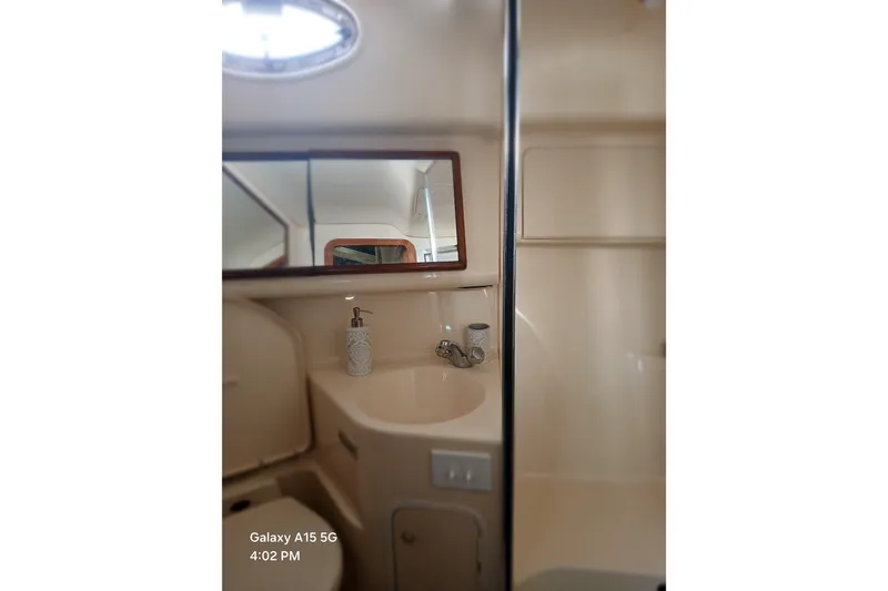 Slide: The Image of Bathroom interior of 2000 Sea Ray 420 Aft Cabin yacht with sink and mirror. - 19