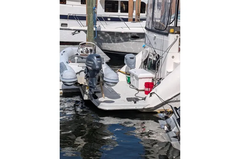 Slide: The Image of Sea Ray 420 Aft Cabin yacht with Yamaha outboard motor and inflatable dinghy. - 4