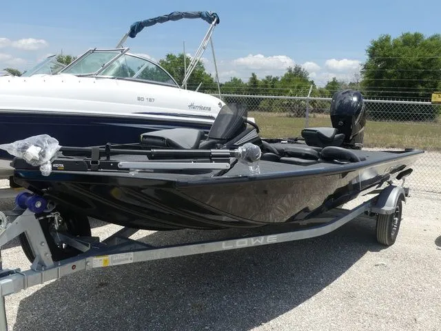 The Image of 2026 Lowe Stinger 175C boat on trailer outdoors. - 1