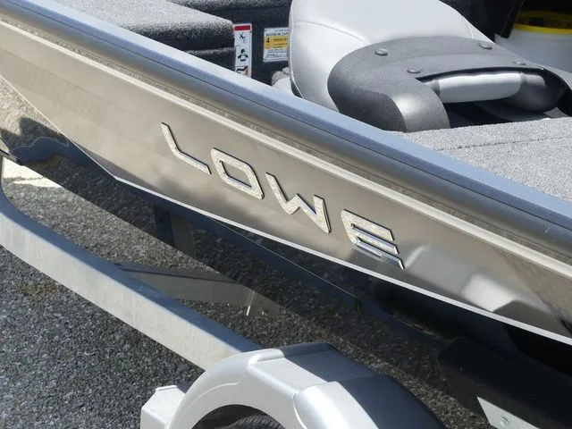 Slide: The Image of 2026 Lowe Stinger 175C boat, close-up of logo. - 7