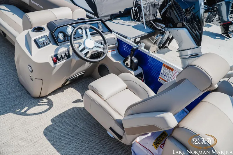 Slide: The Image of 2024 Bennington 22SSR-SPS boat cockpit with steering wheel and controls at Lake Norman Marina. - 10
