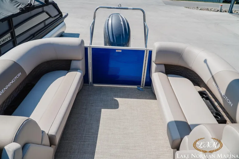 Slide: The Image of 2024 Bennington 22SSR-SPS pontoon boat interior with beige seating at Lake Norman Marina. - 19