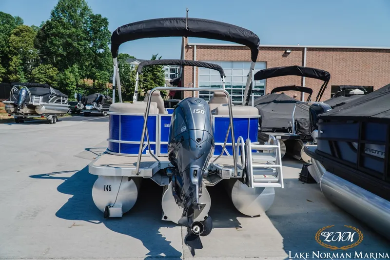 Slide: The Image of 2024 Bennington 22SSR-SPS pontoon boat with outboard motor at Lake Norman Marina. - 4