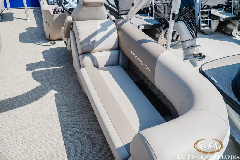 Slide: The Image of 2024 Bennington 22SSR-SPS pontoon boat with luxurious seating at Lake Norman Marina. - 8