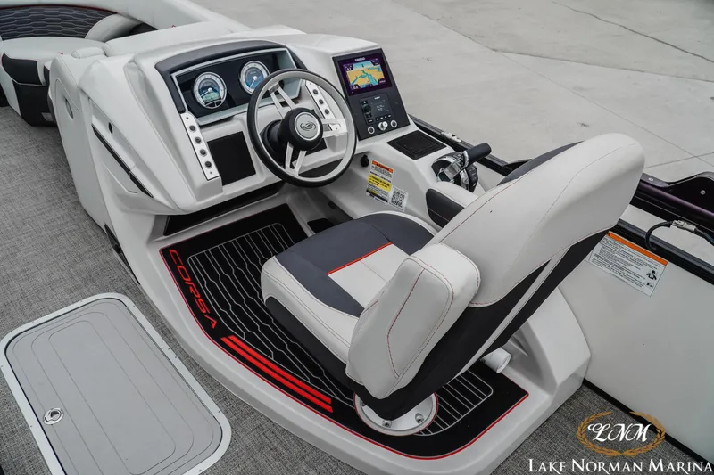 Slide: The Image of 2023 Barletta X23U boat cockpit with modern steering and navigation controls. - 10