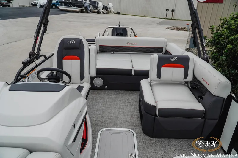 Slide: The Image of 2023 Barletta X23U pontoon boat interior with plush seating and modern design. - 18
