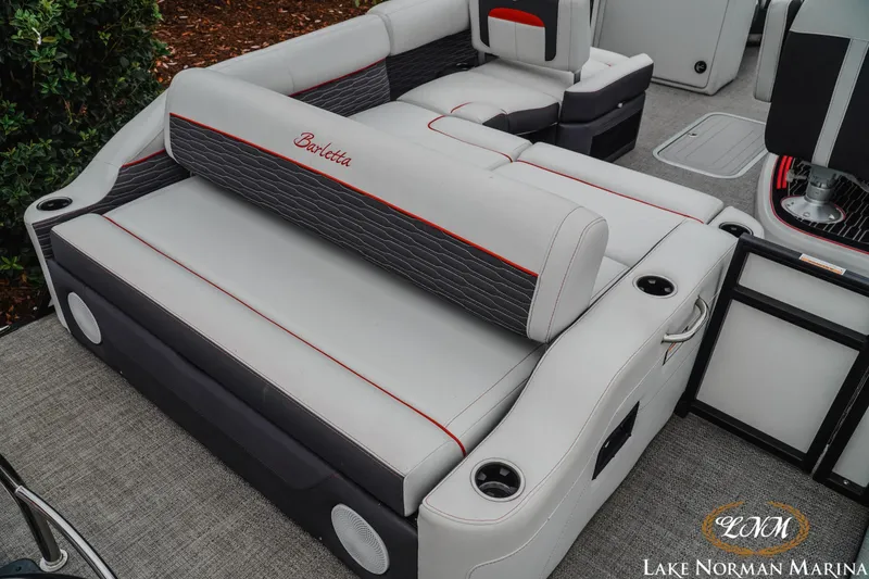 Slide: The Image of 2023 Barletta X23U boat interior with luxurious seating and cup holders at Lake Norman Marina. - 8