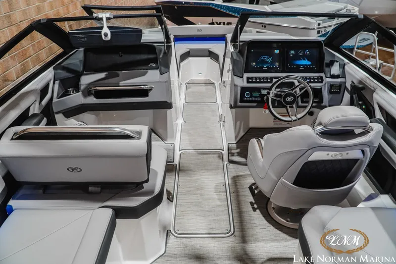 Slide: The Image of 2025 Cobalt R4 boat interior with modern dashboard and seating at Lake Norman Marina. - 11