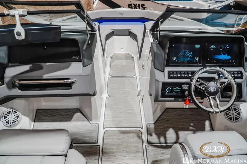 Slide: The Image of Interior of 2025 Cobalt R4 boat with modern dashboard and steering wheel. - 15