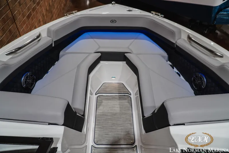 Slide: The Image of 2025 Cobalt R4 boat interior with sleek gray seating and ambient blue lighting. - 16