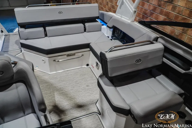 Slide: The Image of 2025 Cobalt R4 boat interior with luxurious gray seating and modern design. - 18
