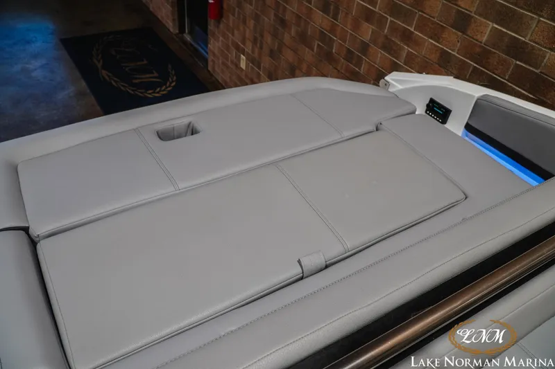 Slide: The Image of 2025 Cobalt R4 boat interior with gray upholstery at Lake Norman Marina. - 23