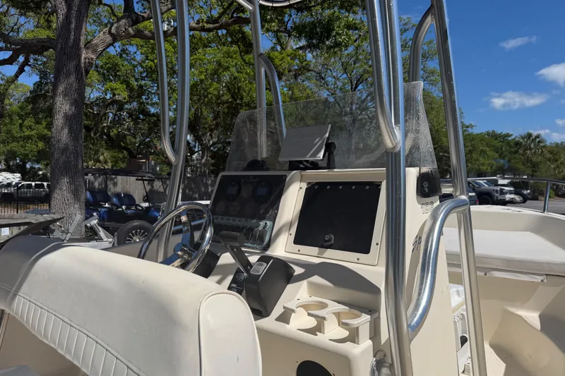 Slide: The Image of 2004 Key West 186 Sportsman boat console with steering wheel and controls. - 7