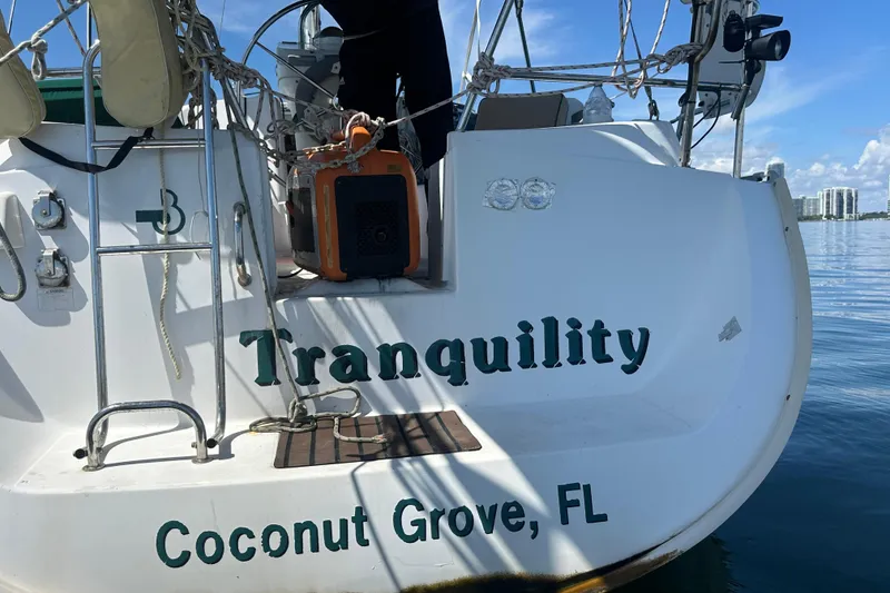 Slide: The Image of Beneteau Oceanis Clipper 331 sailboat named "Tranquility" docked in Coconut Grove, FL, 2003 model. - 15