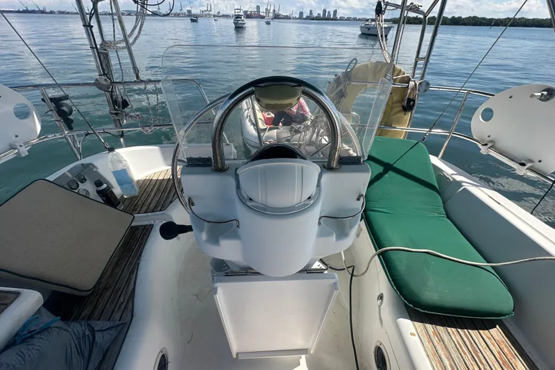 Slide: The Image of Cockpit view of 2003 Beneteau Oceanis Clipper 331 sailboat, with city skyline in background. - 24