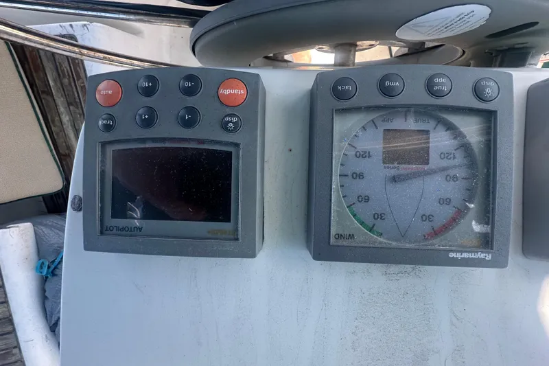 Slide: The Image of Beneteau Oceanis Clipper 331, 2003 model, featuring Raymarine autopilot and wind instruments. - 25