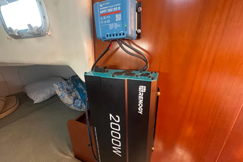 Slide: The Image of 2003 Beneteau Oceanis Clipper 331 with Renogy 2000W inverter and MPPT charge controller. - 68