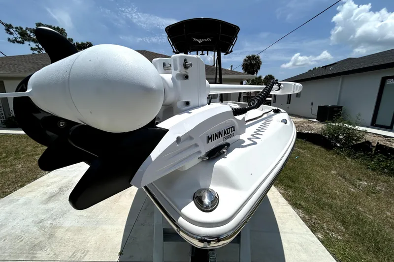 Slide: The Image of Front view of a 2025 Savannah 210X boat with Minn Kota Terrova motor. - 10
