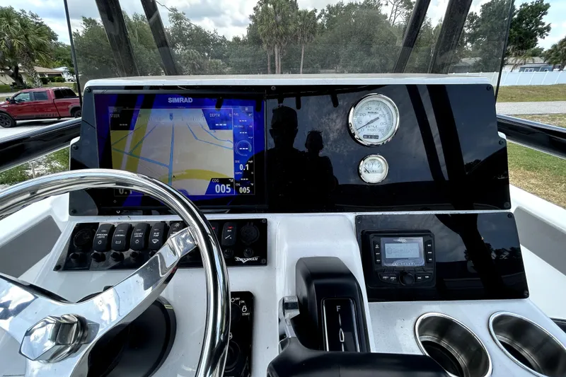 Slide: The Image of Dashboard of 2025 Savannah 210X boat with navigation display and controls. - 22
