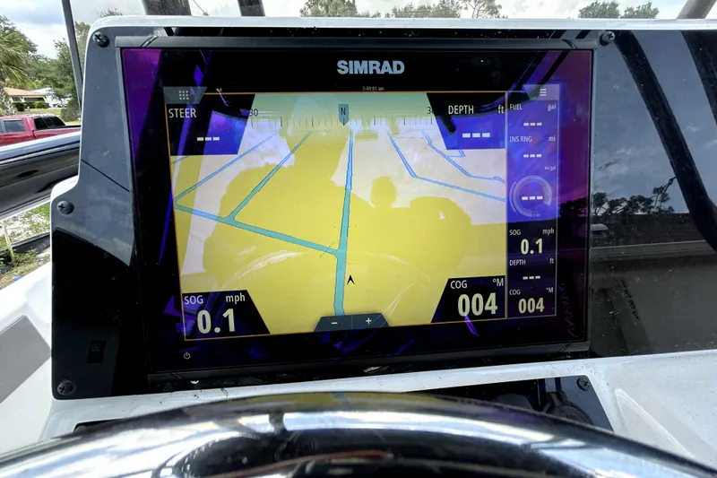 Slide: The Image of Simrad navigation display on Savannah 210X, 2025 model, showing speed and course data. - 23