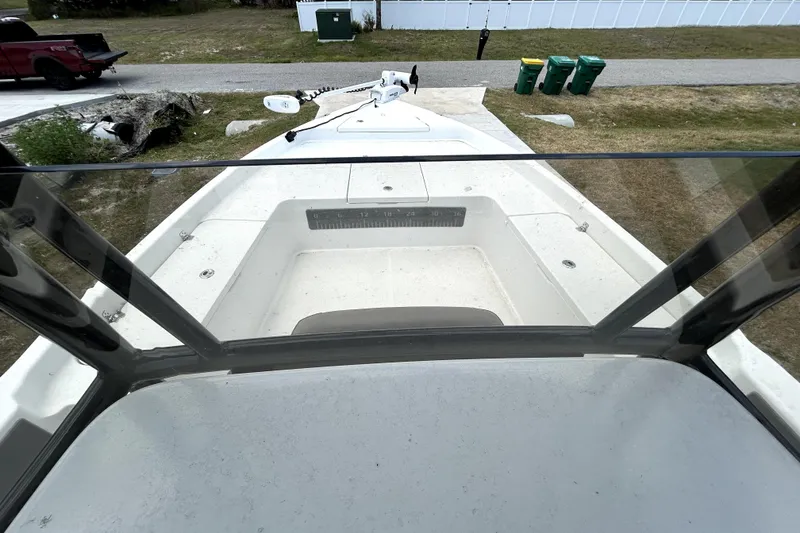 Slide: The Image of Bow view of 2025 Savannah 210X boat, parked on grass near road. - 30