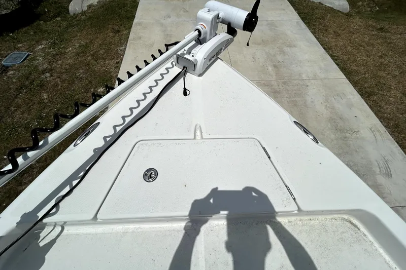 Slide: The Image of Bow of a 2025 Savannah 210X boat with trolling motor and shadow. - 35
