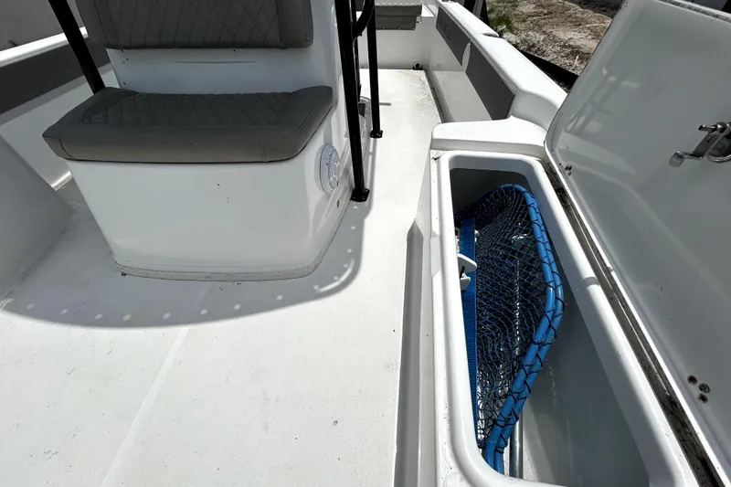 Slide: The Image of Interior of 2025 Savannah 210X boat with seating and storage compartment. - 41