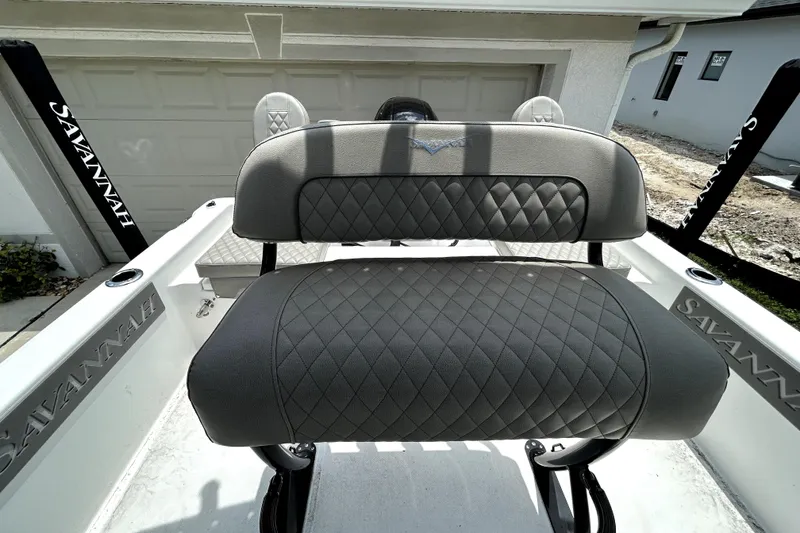Slide: The Image of Savannah 210X 2025 boat seat with diamond-patterned upholstery in a modern setting. - 51
