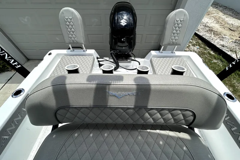 Slide: The Image of 2025 Savannah 210X boat interior with diamond-stitched seating and cup holders. - 52