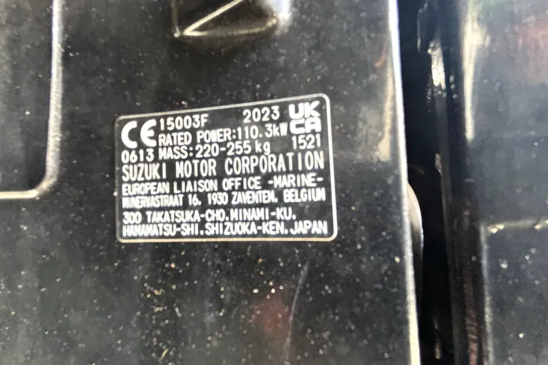 Slide: The Image of Label on Suzuki engine, 2023, showing power and mass specifications. - 63